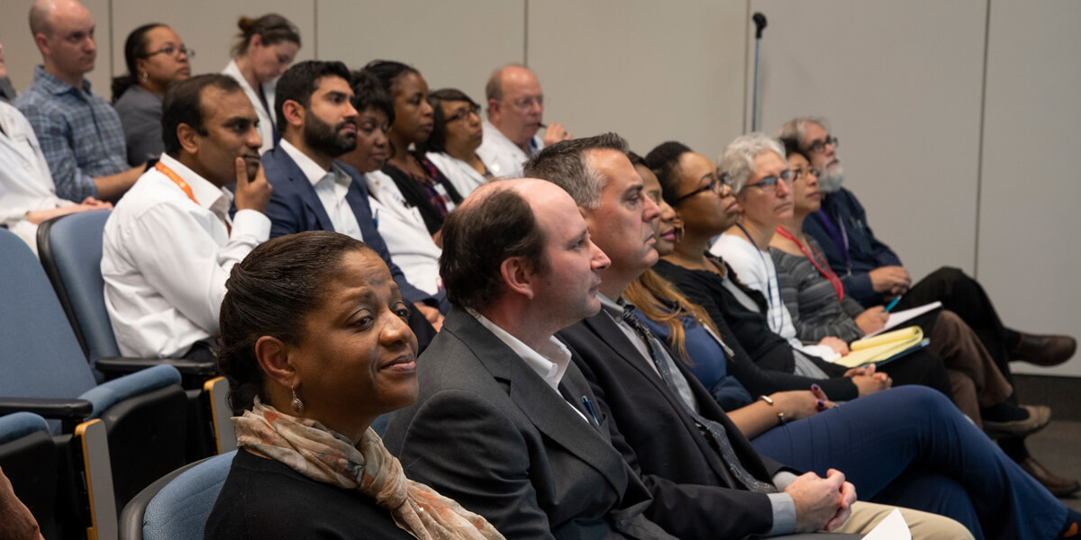Photo of a group of people in auditorium