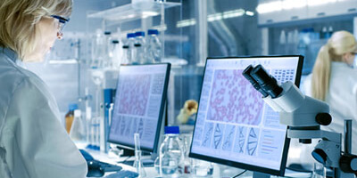 Stock photo of scientist working in lab