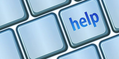 keyboard closeup with help printed on one key
