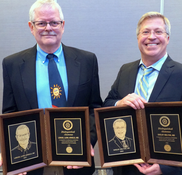 Shelby D Melton, MD & Lemuel Maxwell Arnold, MD holding 2022 Distinguished Alumnus Awards