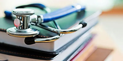 stethoscope atop books