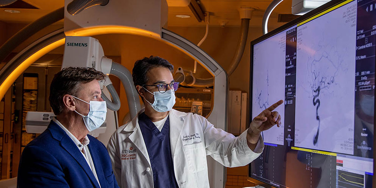 two people reviewing scan