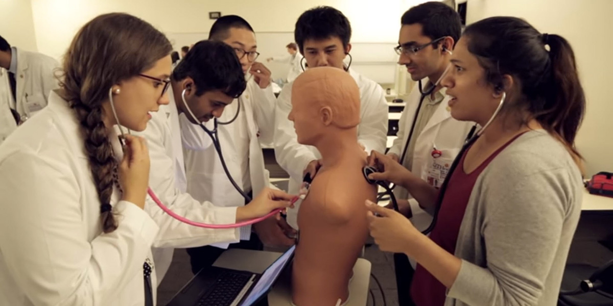 Students practicing on mannequin
