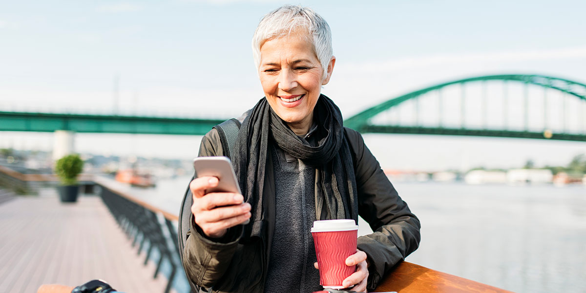 woman holding mobile telephone