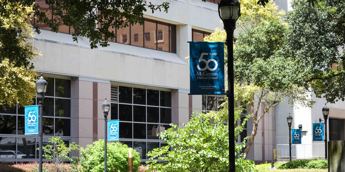 50th anniversary banner in front of the McGovern Medical school