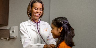 Dr. Love examines a young patient.
