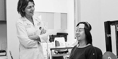 medical professional with patient in therapy