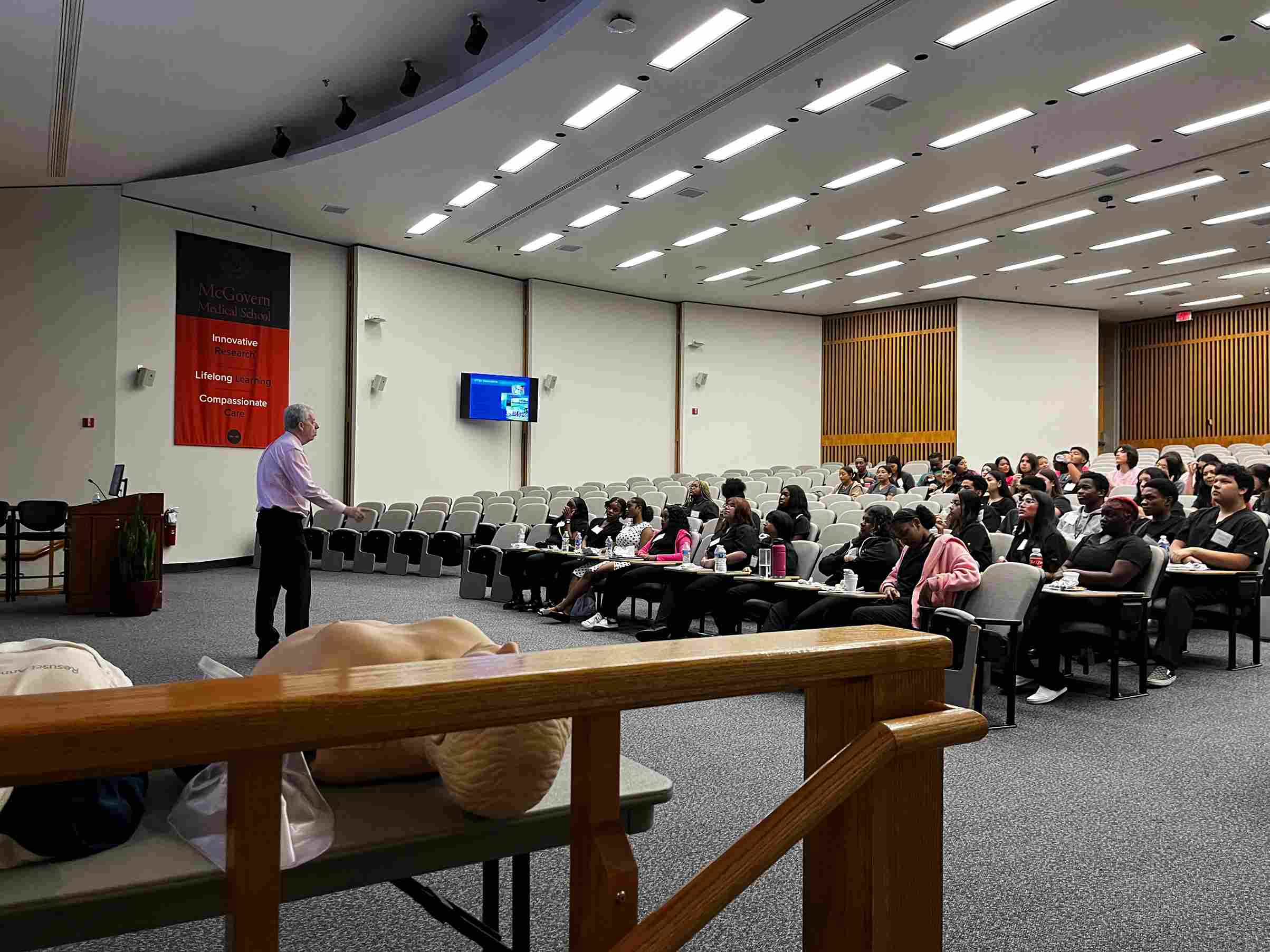 students in Aspirations in Medical Professions program listening to lecture by Dr. Robert Spears from the School of Dentistry